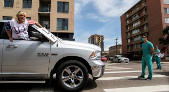 Healthcare workers counter anti-lockdown protests in Colorado’s Denver amid rising cases