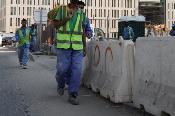 Qatar Migrant workers were walking on the road