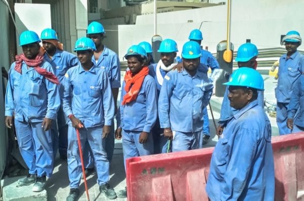 A group of Asian workers at the construction site