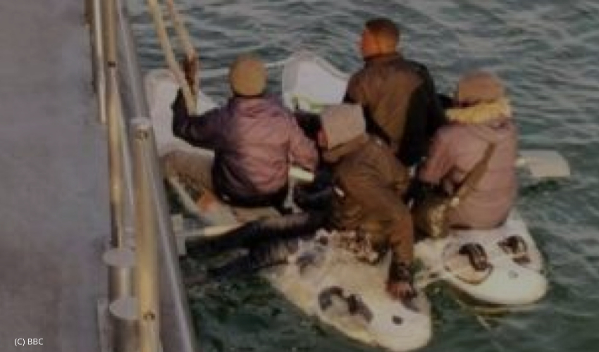 Migrants attempt to cross English Channel on a surfboard, intercepted and returned to France