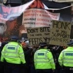 Demonstrators-supporting-farmers-protests-in-India,-gather-outside-Indian-Embassy-in-UK