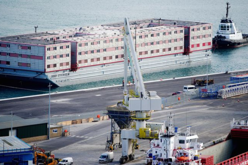 bibby stockholm engineless barge set to house asylum seekers arrives in dorset