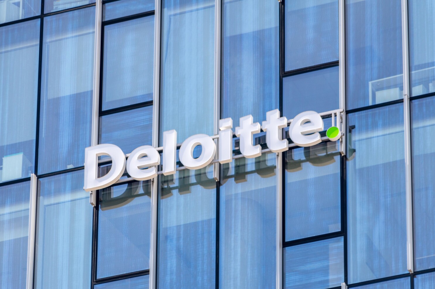 gdansk, poland may 8, 2022: logo and sign of deloitte, multina