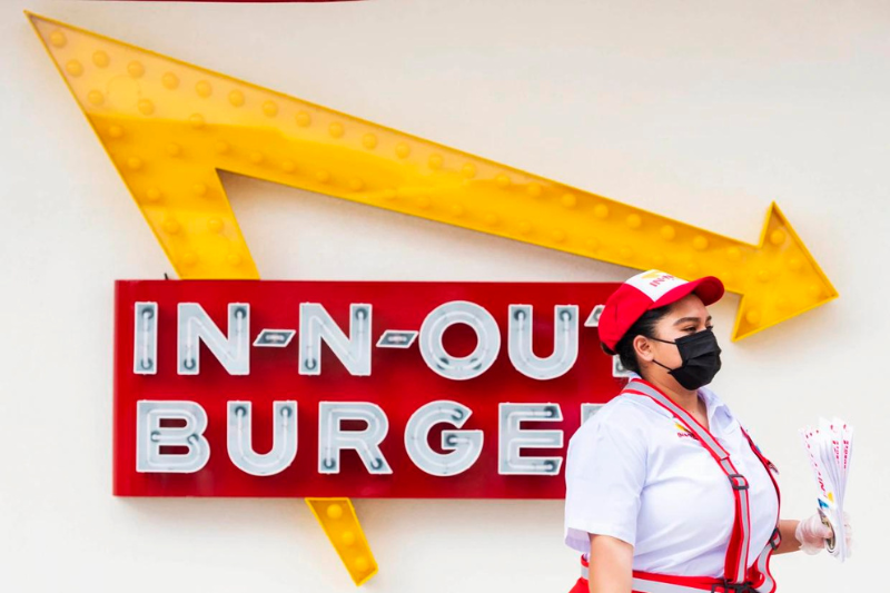 cheeseburgers with a smile in n out burger enforces no mask, all smiles policy for employees