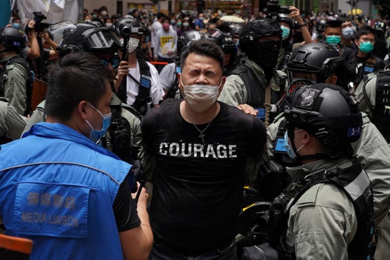 china promises to suppress political dissent by detaining human rights campaigner