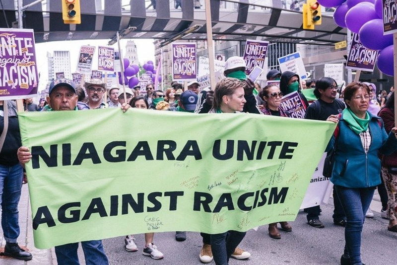 demonstrators march in niagara on the lake for migrant workers’ rights