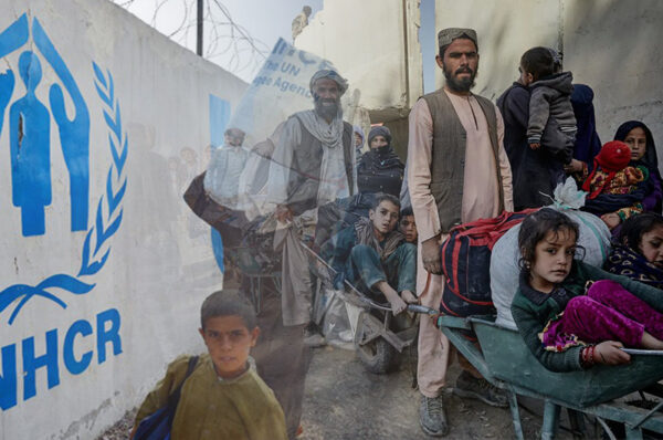 displaced afghans receive assistance as they