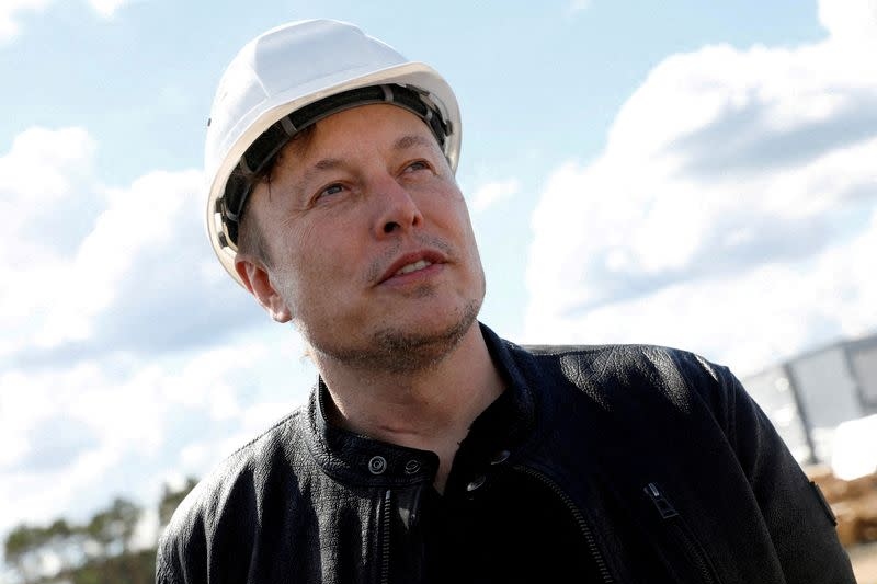elon musk says tesla needs to cut staff by 10%, pauses all hiring worldwide