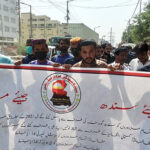 Textile workers protest outside their company as they demand for minimum wages
