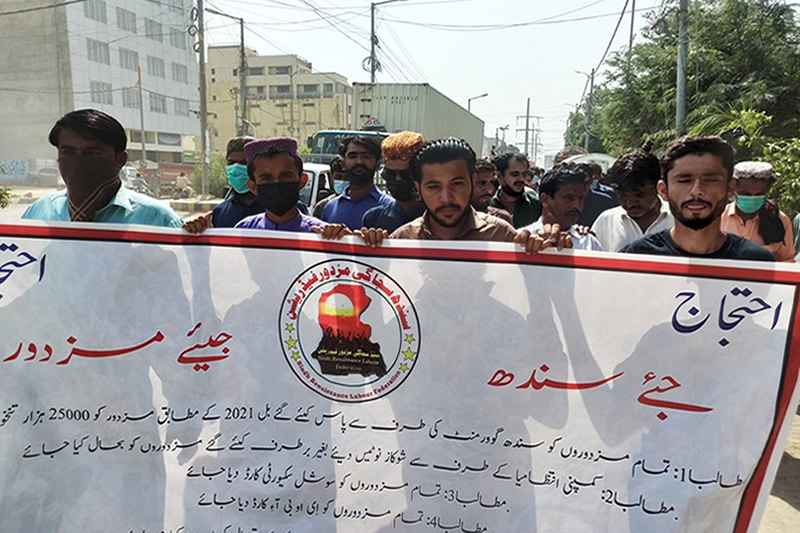Textile workers protest outside their company as they demand for minimum wages