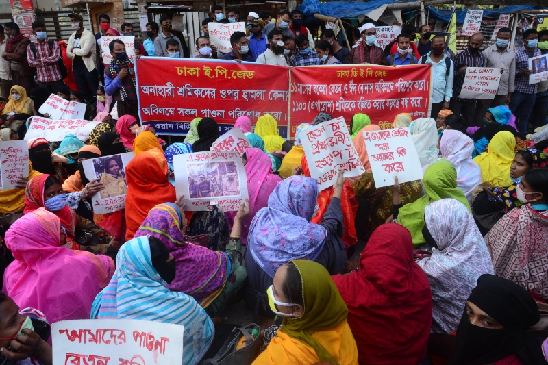 labor leaders took out a rally to approve full wage & festival allowance for dhaka factory workers
