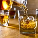 whiskey and natural ice on old wooden table