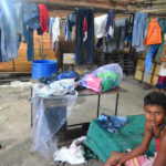 singapore economy dependent on migrant workers, improving working and living conditions