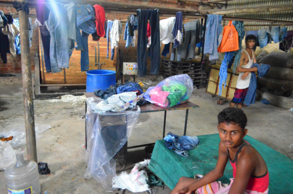 singapore economy dependent on migrant workers, improving working and living conditions