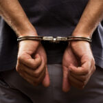 close up. arrested man handcuffed