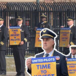 united pilots picket board meeting in houston, demanding
