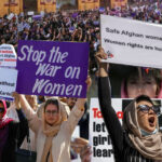 women's day demonstrators rally for rights, with special emphasis on iran and afghanistan