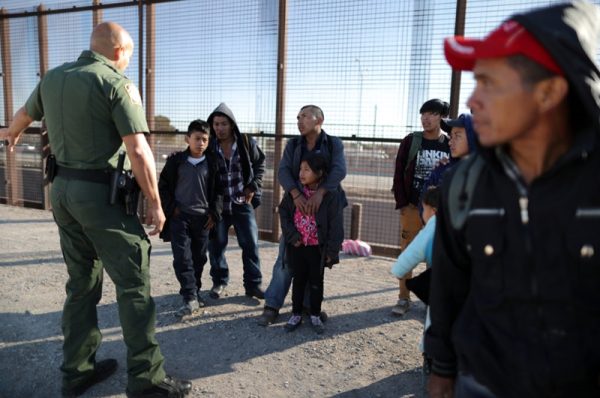 file photo: a group of central american migrants is questioned about their children's health after surrendering to u.s. border patrol agents south of the u.s. mexico border fence in el paso